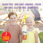 Two smiling children outdoors, one holding a kids’ vitamin bottle, with health benefit text above them