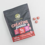 Sunwarrior Active Creatine gummies pouch with strawberry flavored pink gummies beside it on white background