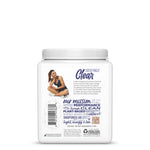 Back of a white container with text about clear plant-based protein powder and a woman in workout clothes sitting cross-legged
